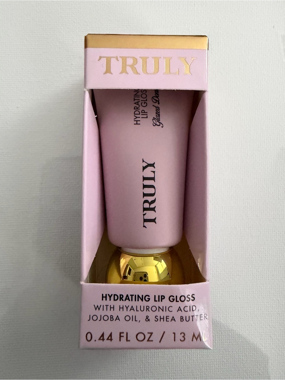 TRULY Hydrating Lip Gloss Tube in Light Pink with Gold Cap